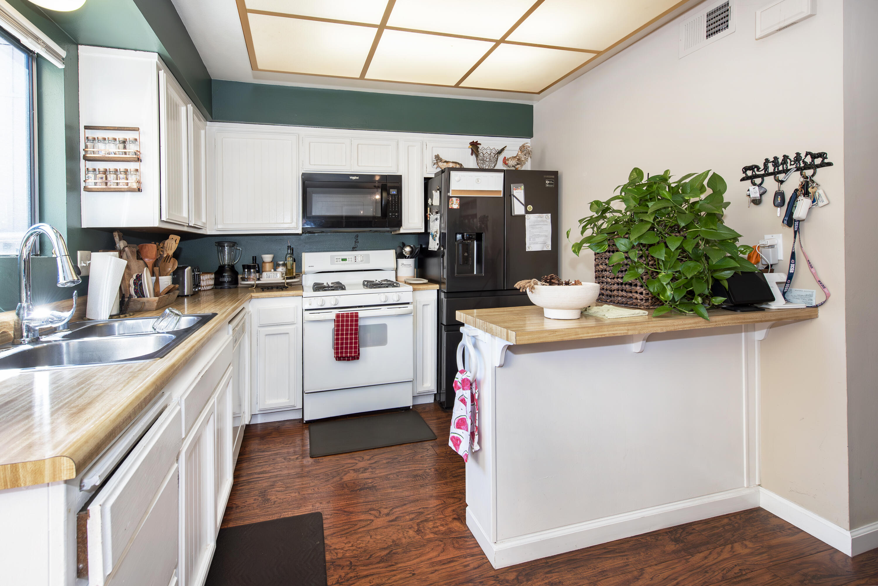 214 North R Street Lompoc, CA 93436 - Photo 6 of 15 a kitchen with a sink appliances and cabinets