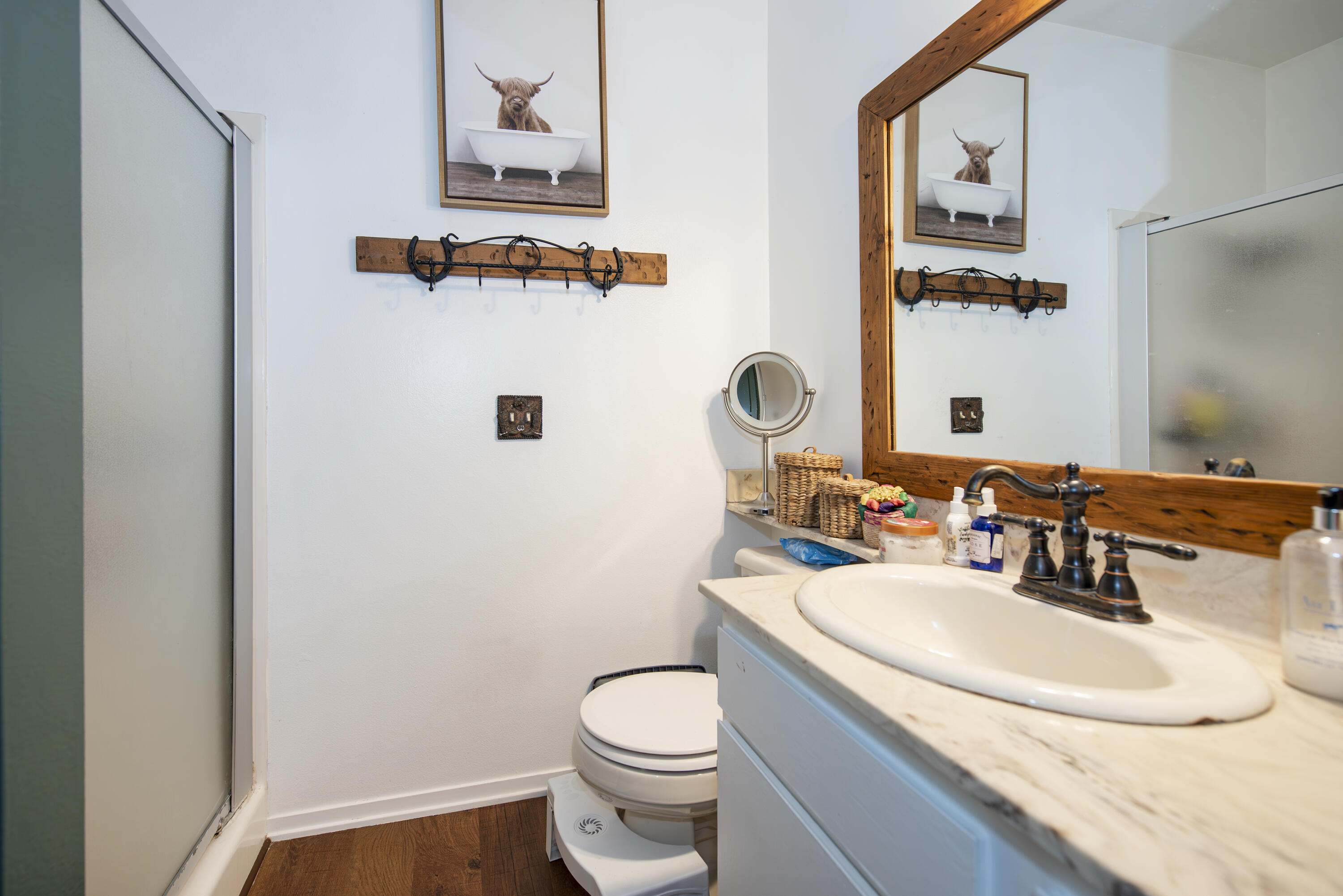 214 North R Street Lompoc, CA 93436 - Photo 8 of 15 a bathroom with a sink toilet and mirror