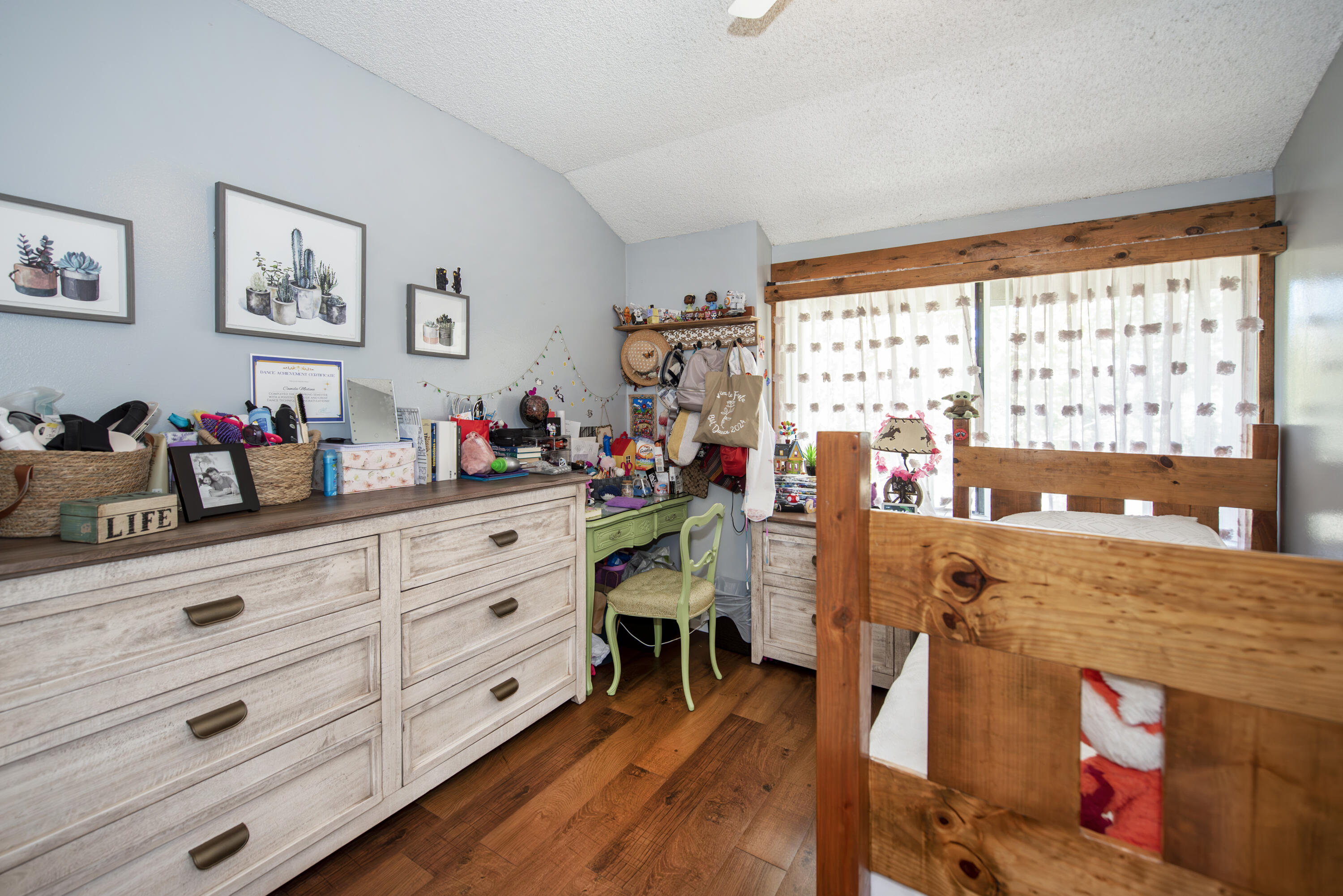 214 North R Street Lompoc, CA 93436 - Photo 9 of 15 a view of a dining room with furniture a chandelier and wooden floor