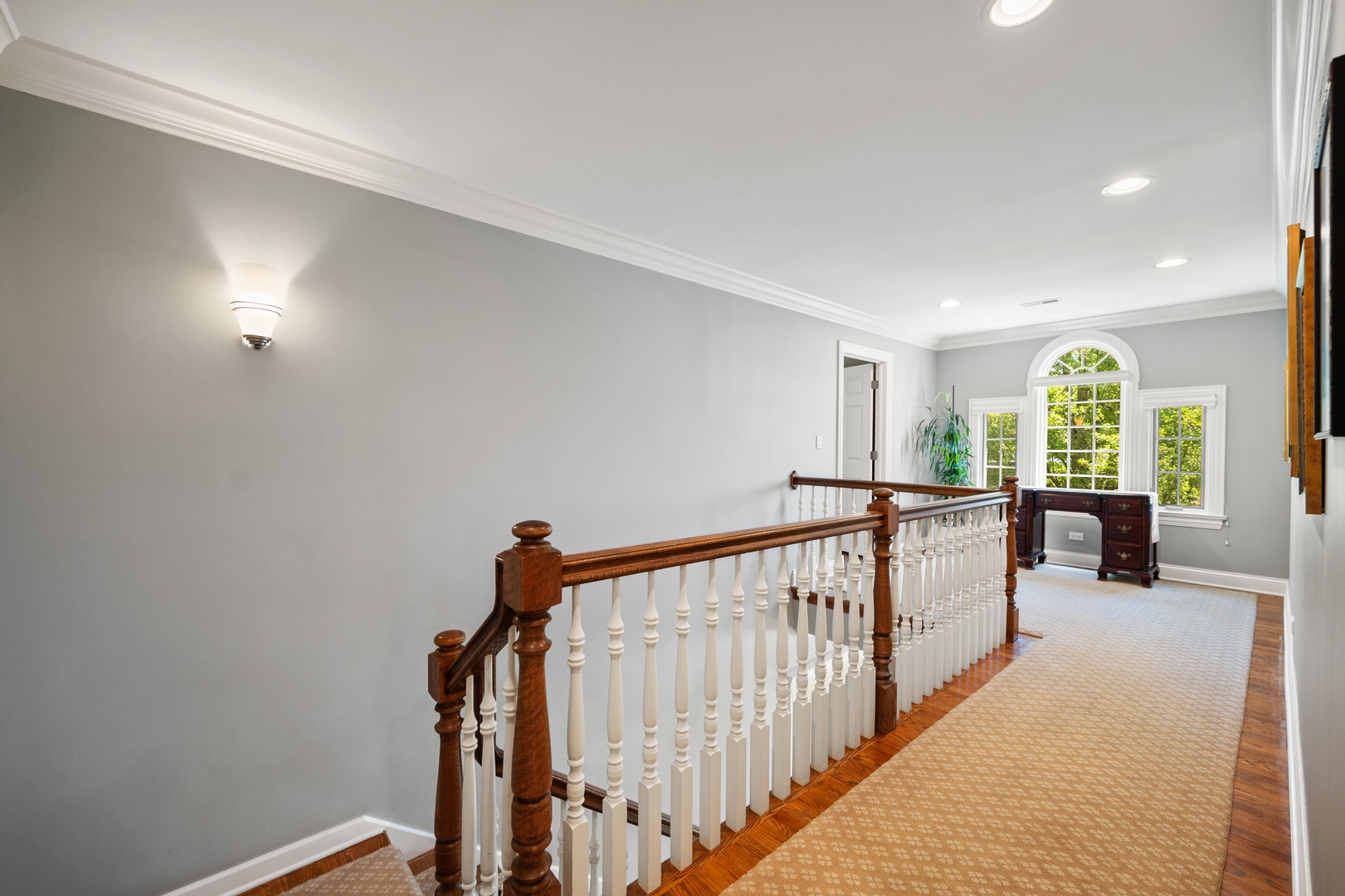 1622 Brandon Road Glenview, IL 60025 - Photo 16 of 31 a view of a hallway with furniture and floor to ceiling window