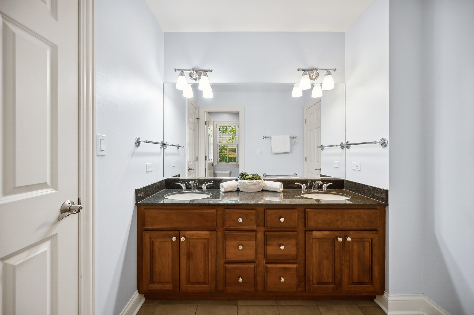 1622 Brandon Road Glenview, IL 60025 - Photo 20 of 31 a bathroom with a granite countertop double vanity sink and mirror