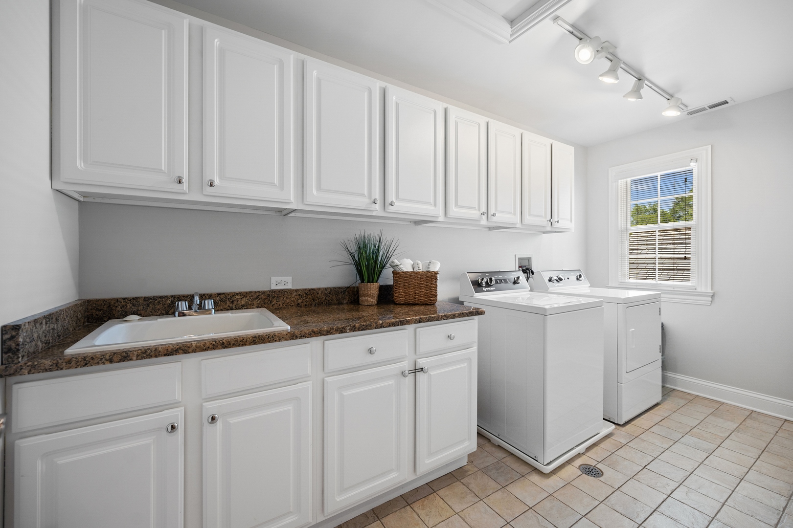 1622 Brandon Road Glenview, IL 60025 - Photo 21 of 31 a kitchen with granite countertop white cabinets and white appliances