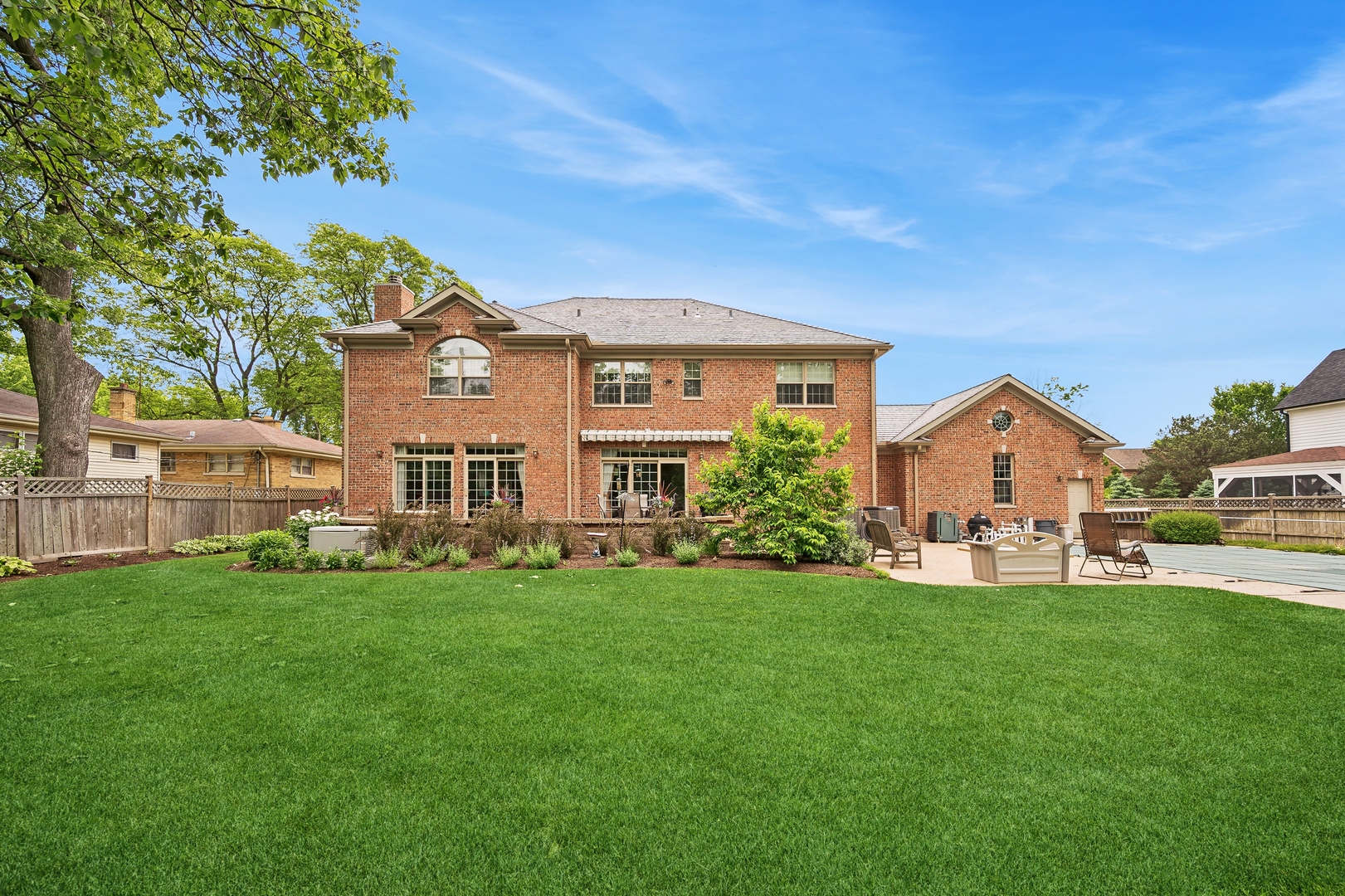 1622 Brandon Road Glenview, IL 60025 - Photo 28 of 31 a view of a house with a big yard and large trees