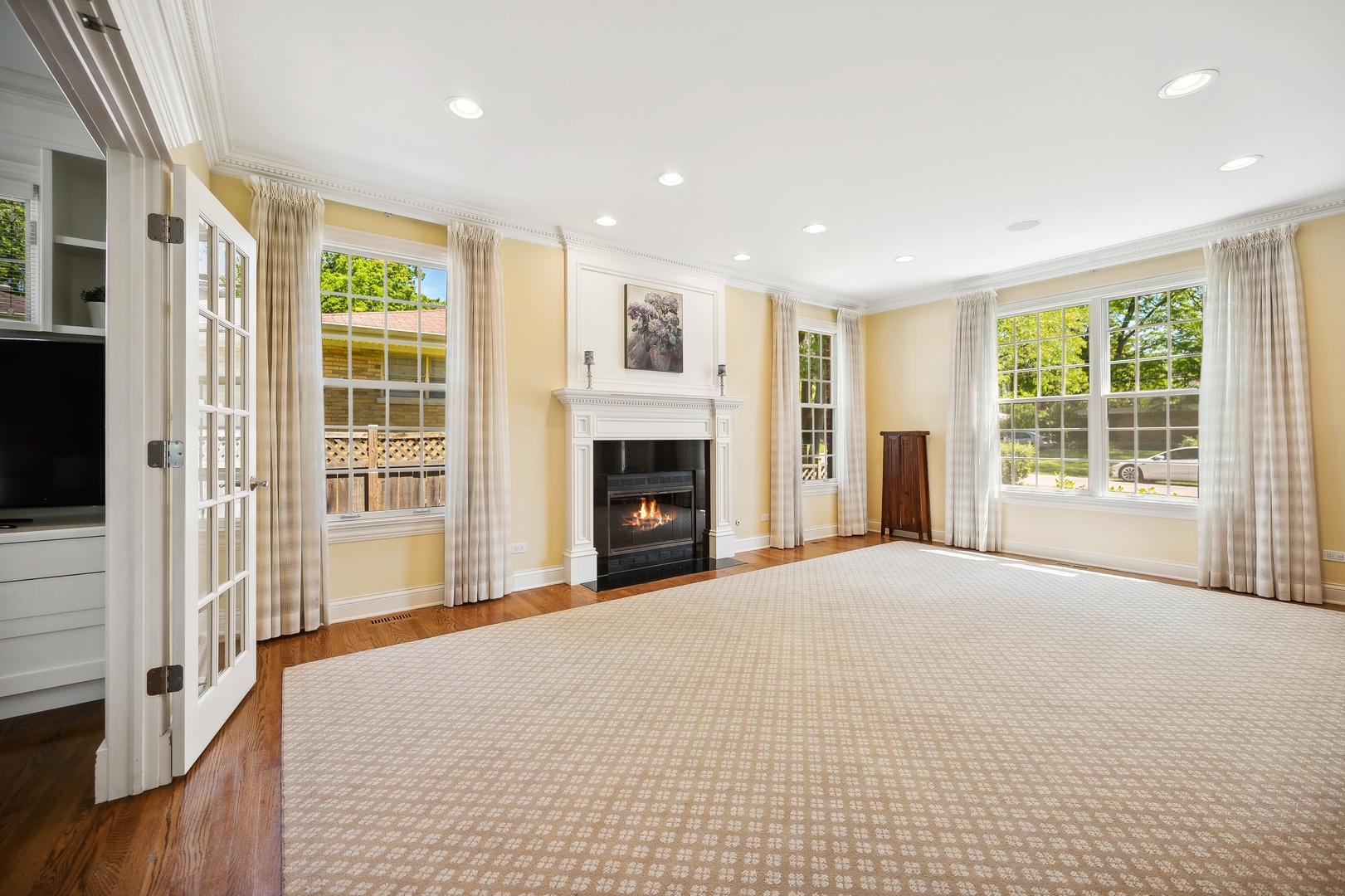 1622 Brandon Road Glenview, IL 60025 - Photo 3 of 31 a view of an empty room with wooden floor and a window