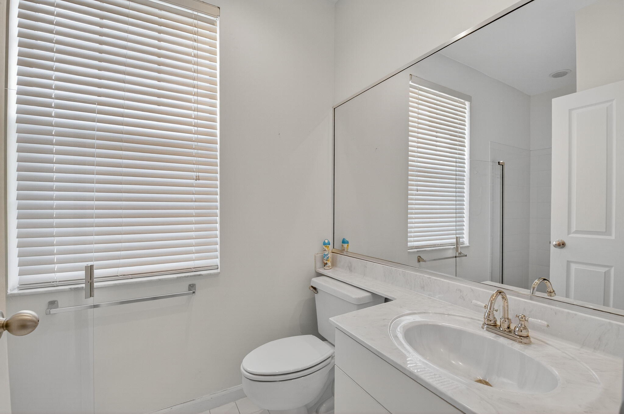 5309 Northwest 26th Circle Boca Raton, FL 33496 - Photo 14 of 37 a bathroom with a sink and a toilet