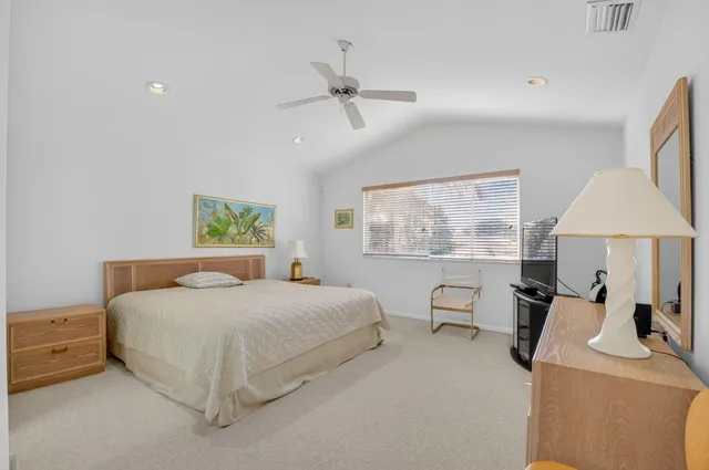 a bedroom with a bed and a table with chair