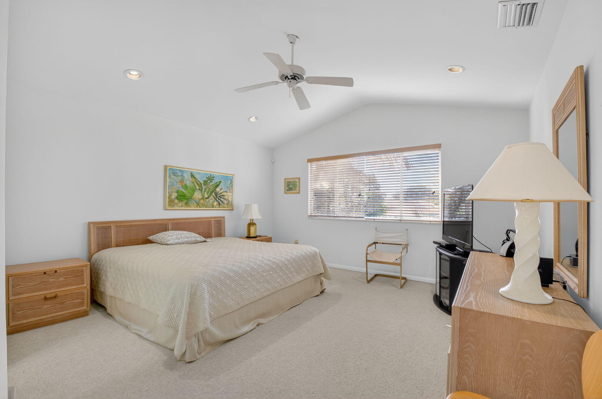 5309 Northwest 26th Circle Boca Raton, FL 33496 - Photo 17 of 37 a bedroom with a bed and a table with chair