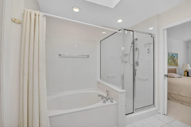 a bathroom with a bathtub and a shower
