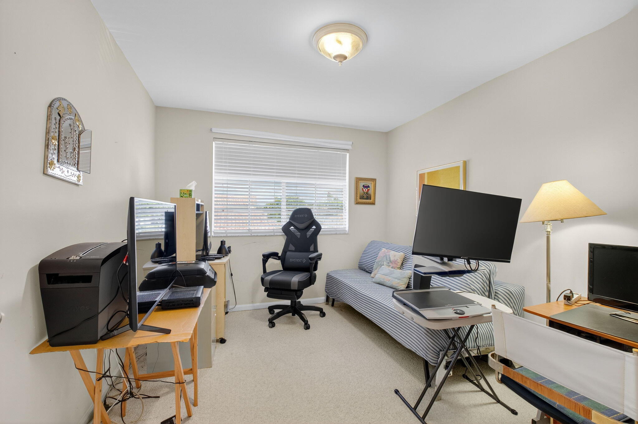 5309 Northwest 26th Circle Boca Raton, FL 33496 - Photo 21 of 37 a living room with furniture and a flat screen tv