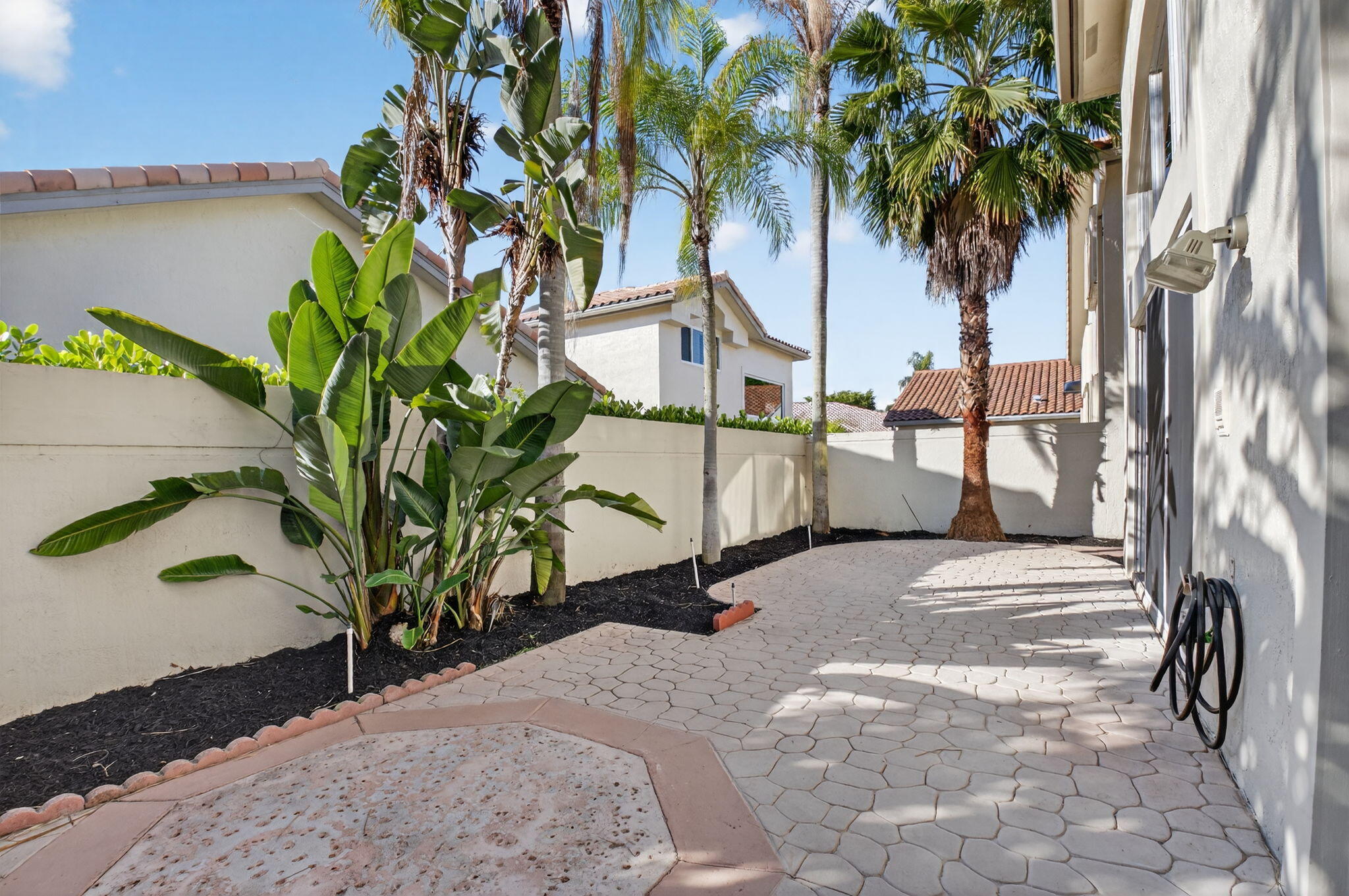 5309 Northwest 26th Circle Boca Raton, FL 33496 - Photo 22 of 37 a picture of a table and chairs in patio