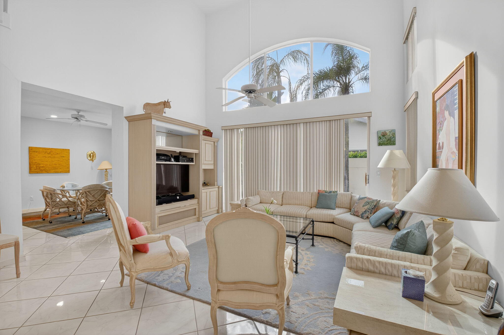 5309 Northwest 26th Circle Boca Raton, FL 33496 - Photo 10 of 37 a living room with furniture and a chandelier