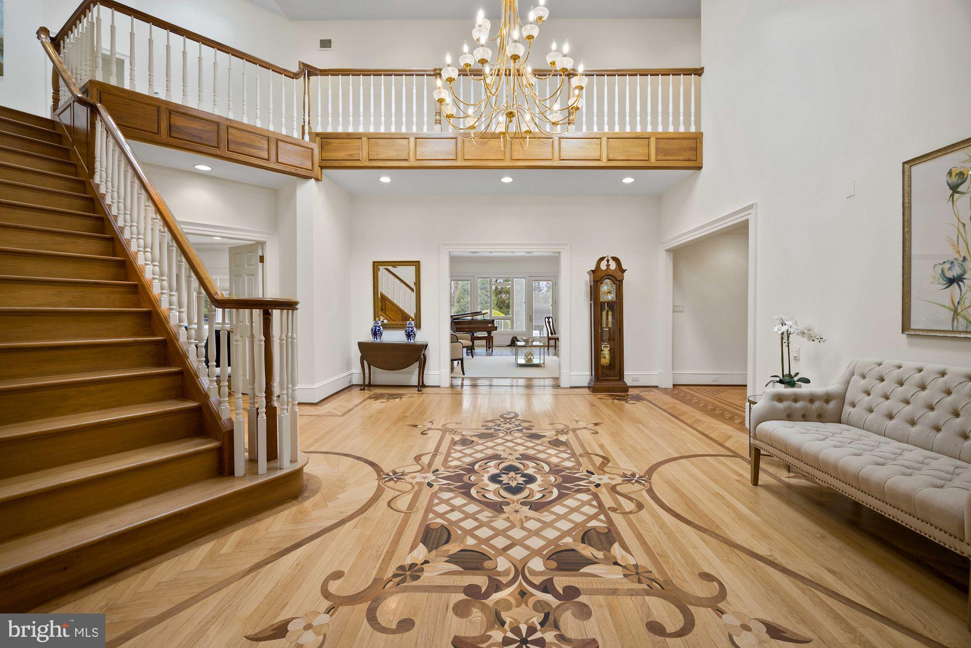 7118 Arrowood Road Bethesda, MD 20817 - Photo 5 of 59 Sweeping Oak Staircase with Inlaid Flooring