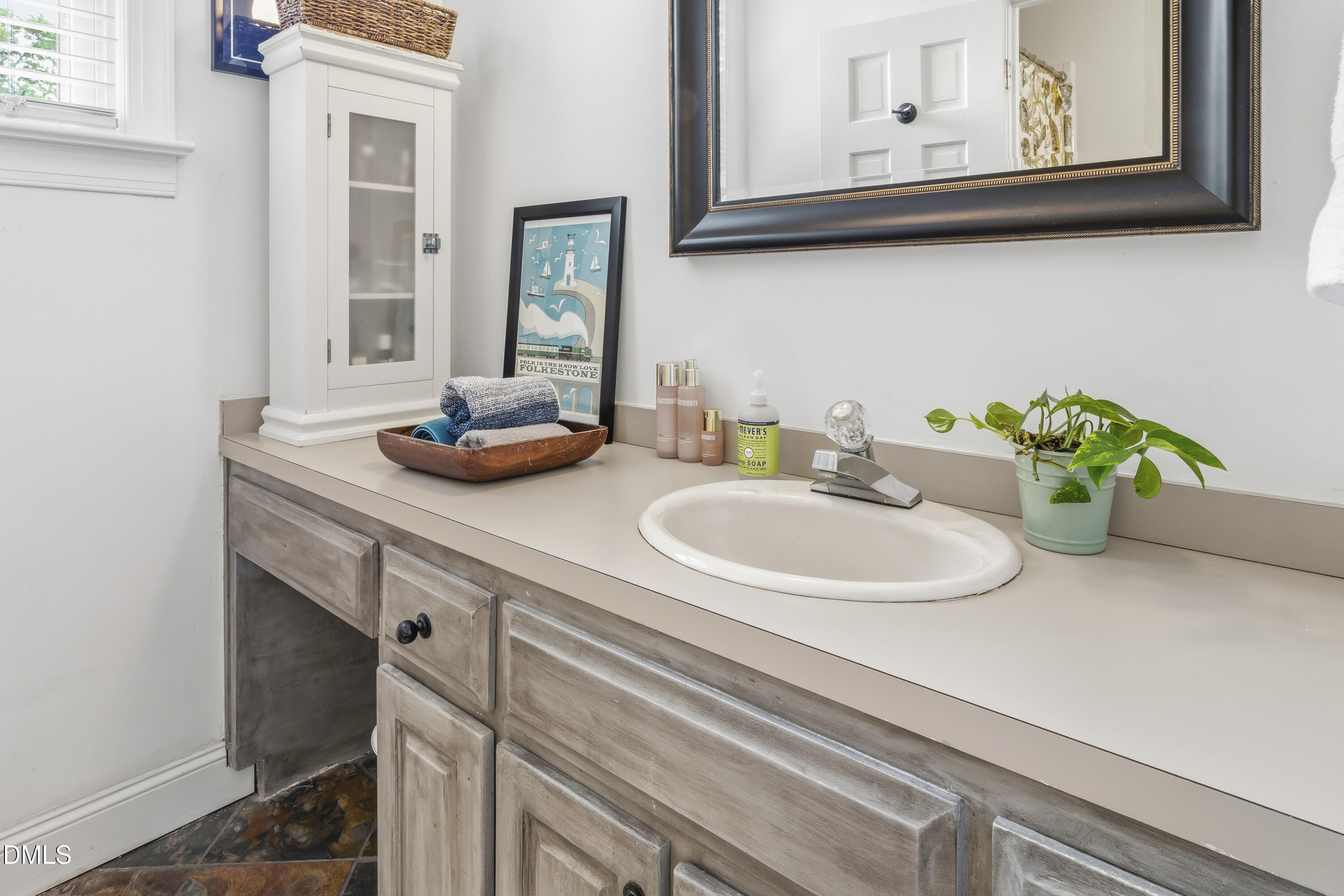 3004 West Annaley Drive Raleigh, NC 27604 - Photo 27 of 44 a bathroom with a sink and a mirror