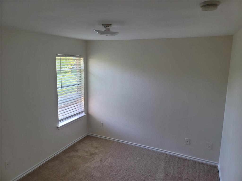 1256 Redman Avenue Mesquite, TX 75149 - Photo 4 of 8 an empty room with windows