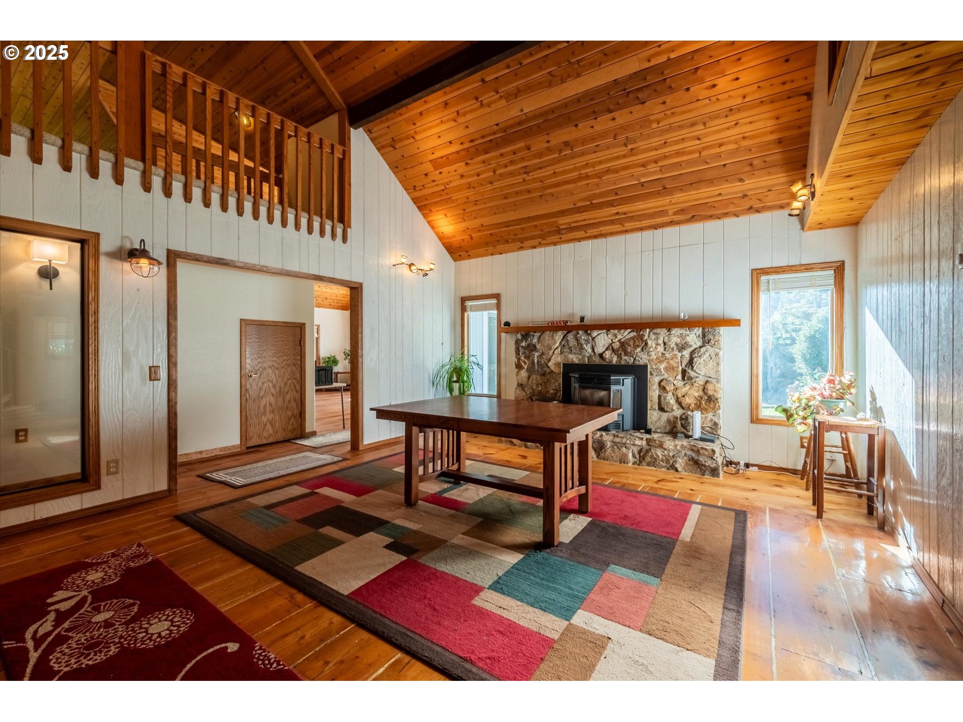 54177 Morrison Road Bandon, OR 97411 - Photo 11 of 47 a living room with furniture a rug and a table