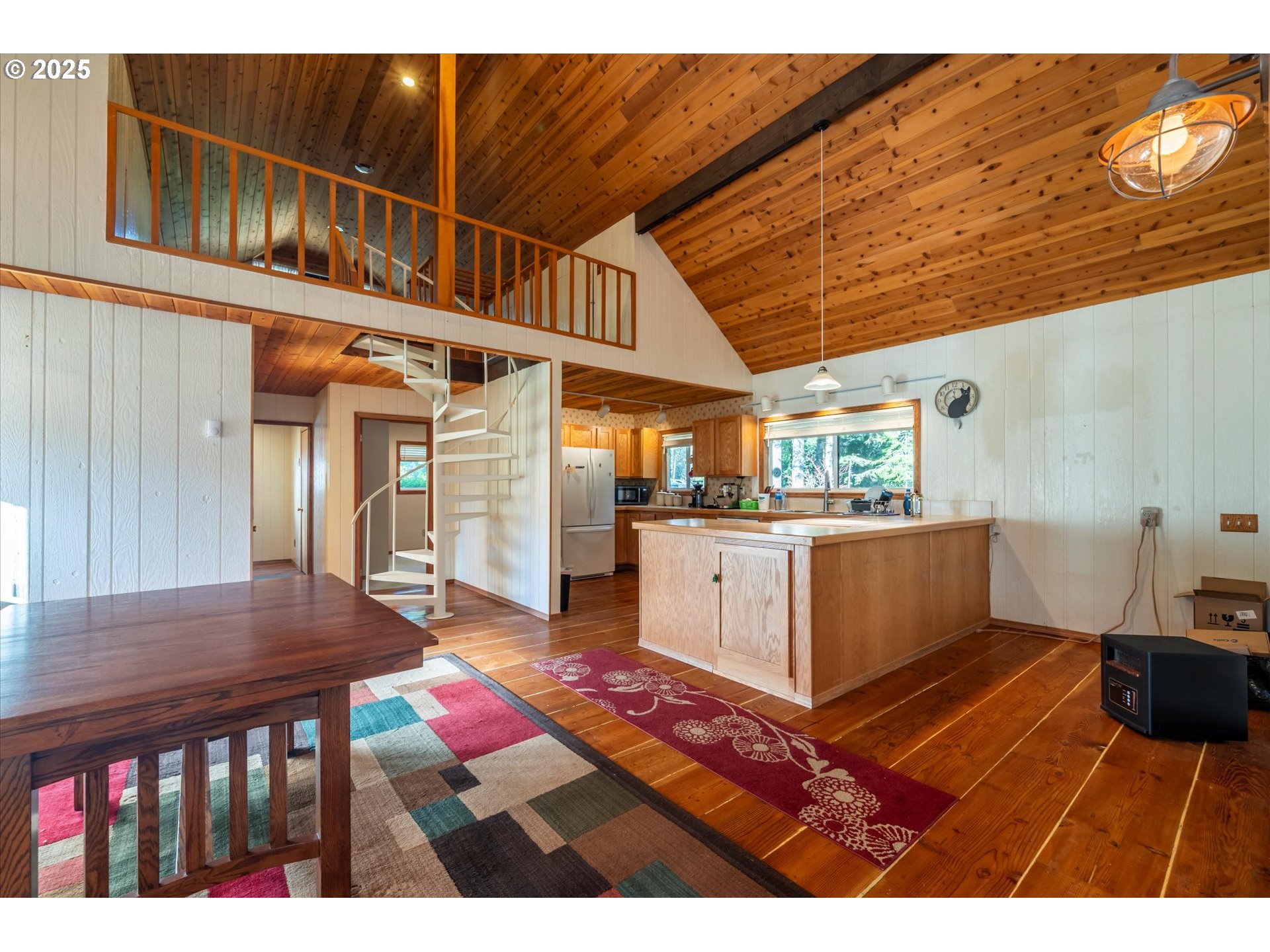54177 Morrison Road Bandon, OR 97411 - Photo 13 of 47 a view of kitchen with furniture and wooden floor