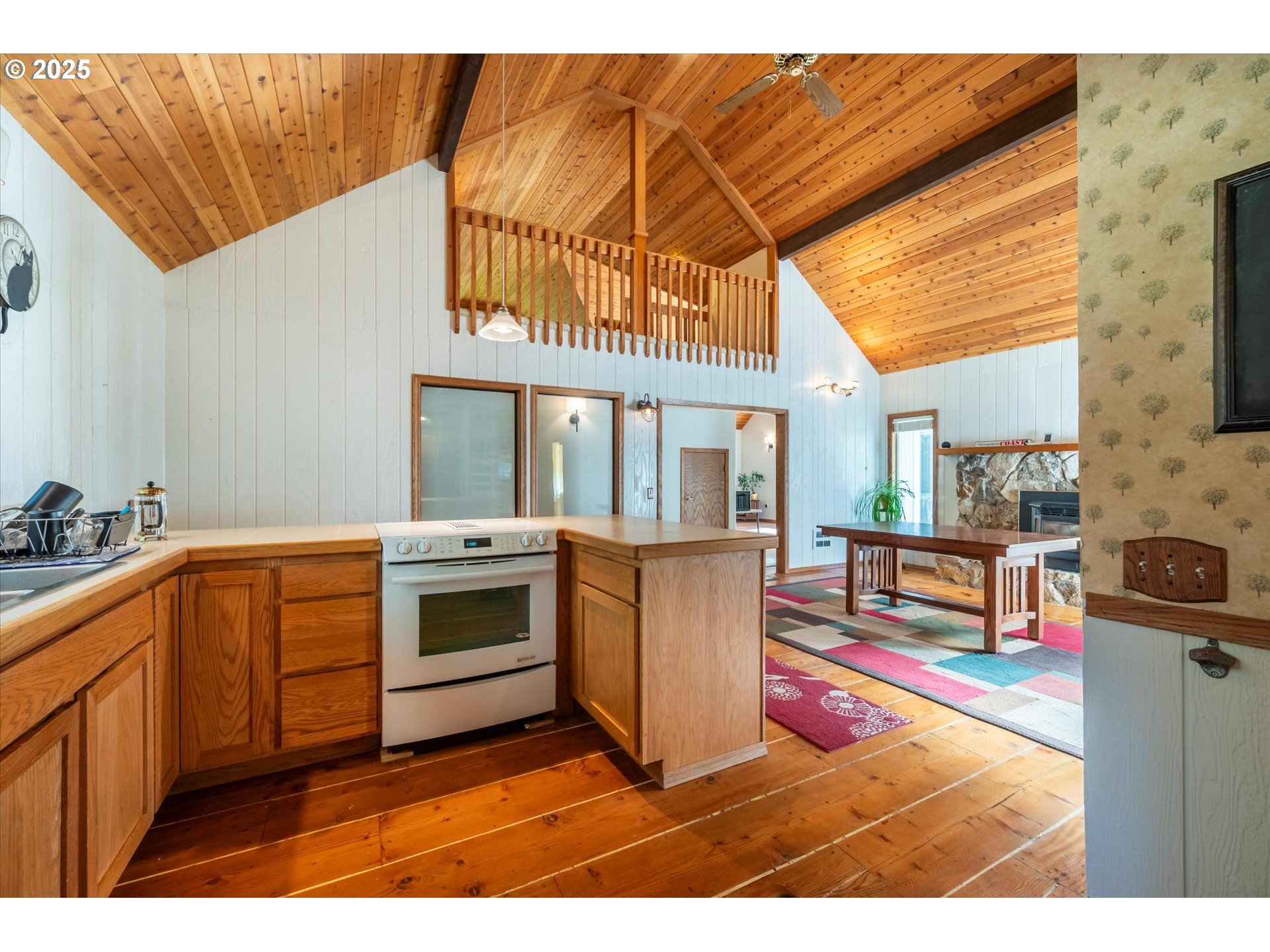 54177 Morrison Road Bandon, OR 97411 - Photo 14 of 47 a kitchen with stainless steel appliances granite countertop a stove a sink and a refrigerator