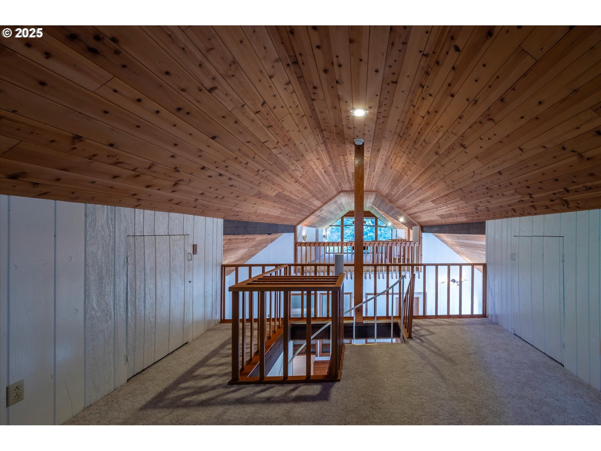 54177 Morrison Road Bandon, OR 97411 - Photo 22 of 47 a view of an empty room with wooden floor