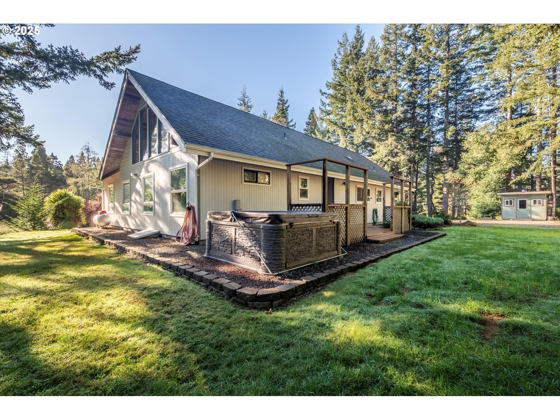 54177 Morrison Road Bandon, OR 97411 - Photo 3 of 47 a view of a house with a yard porch and sitting area