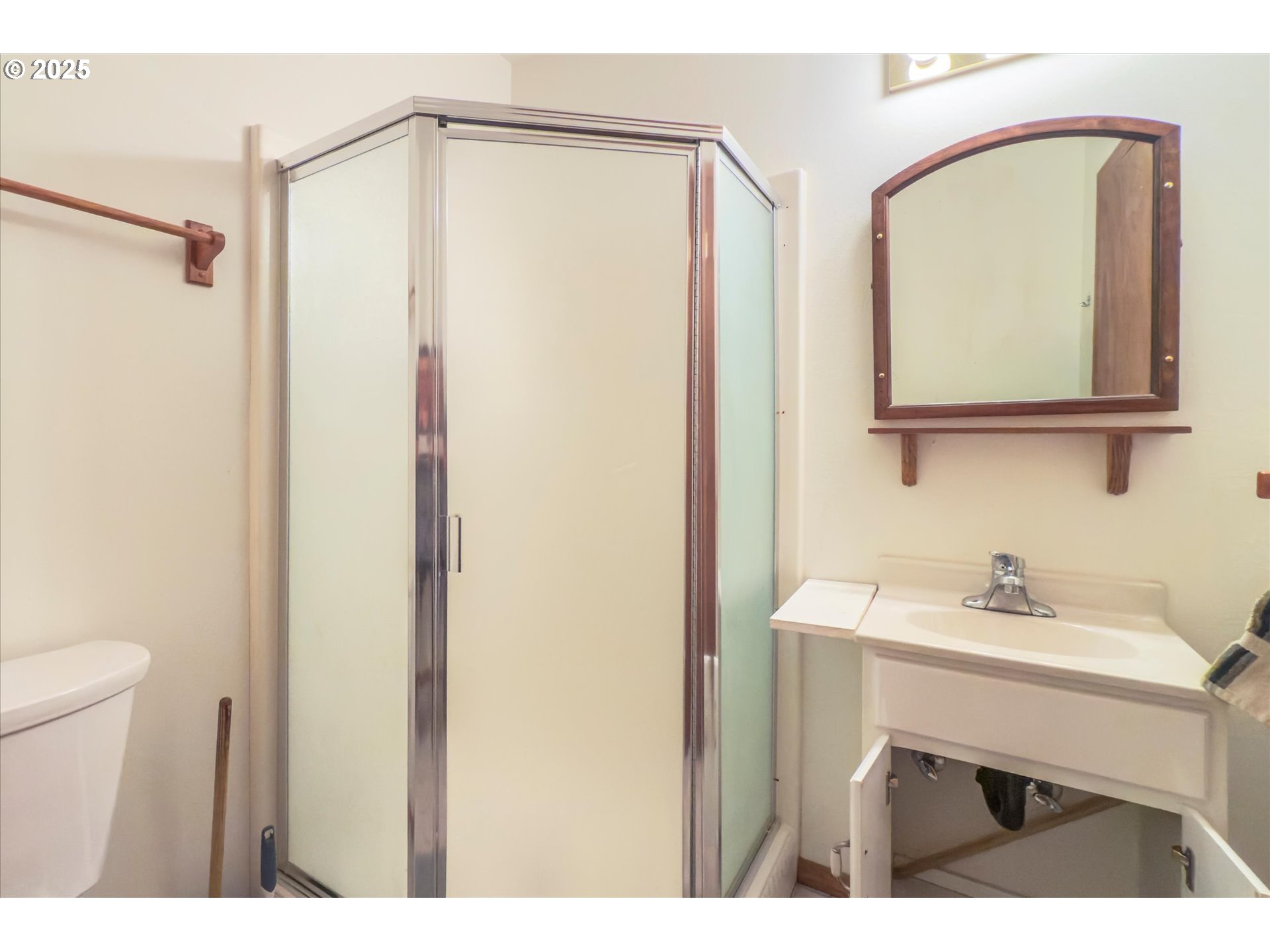 54177 Morrison Road Bandon, OR 97411 - Photo 34 of 47 a bathroom with a sink mirror vanity and toilet