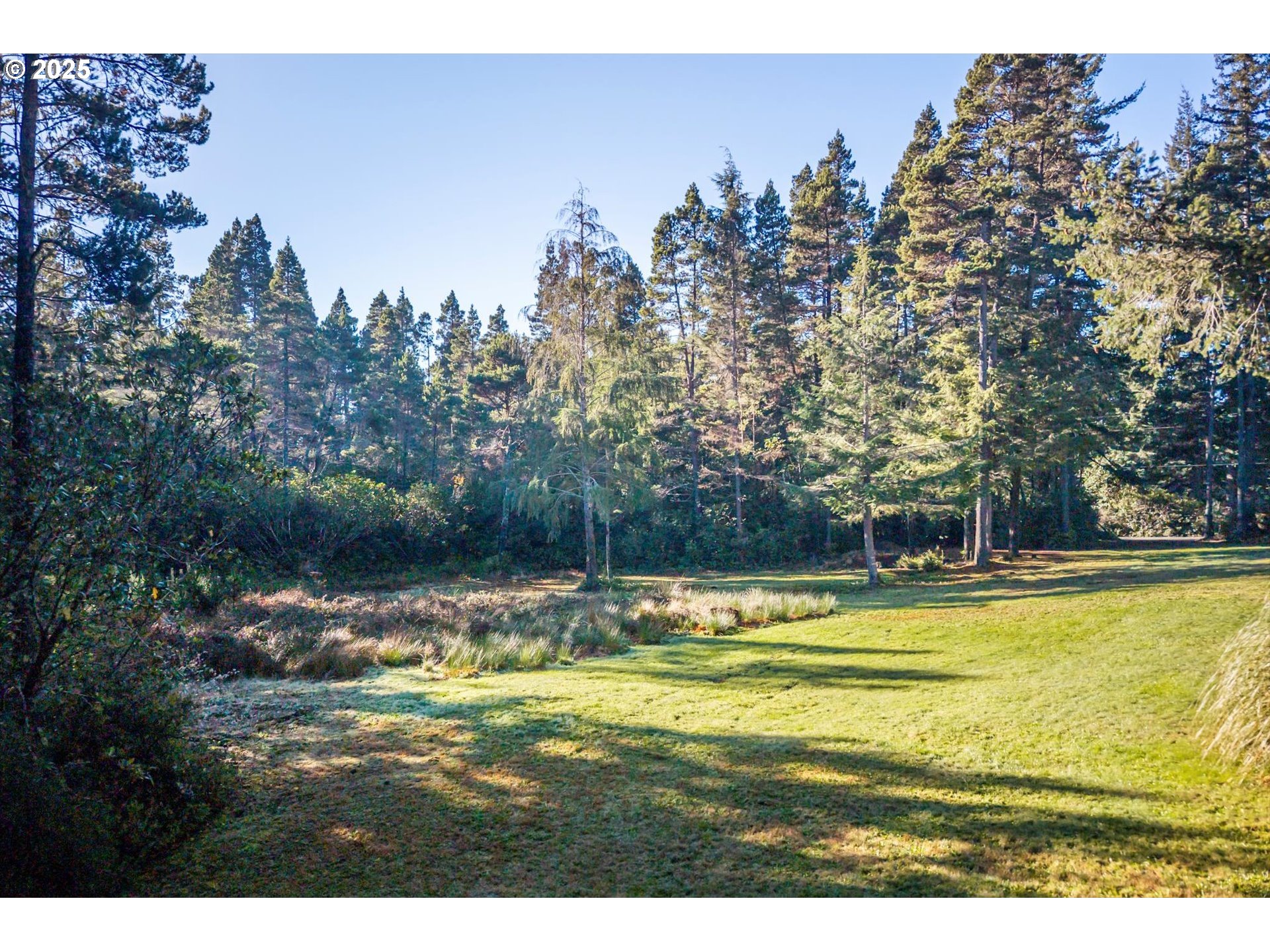 54177 Morrison Road Bandon, OR 97411 - Photo 38 of 47 a view of a swimming pool with an outdoor space and seating area