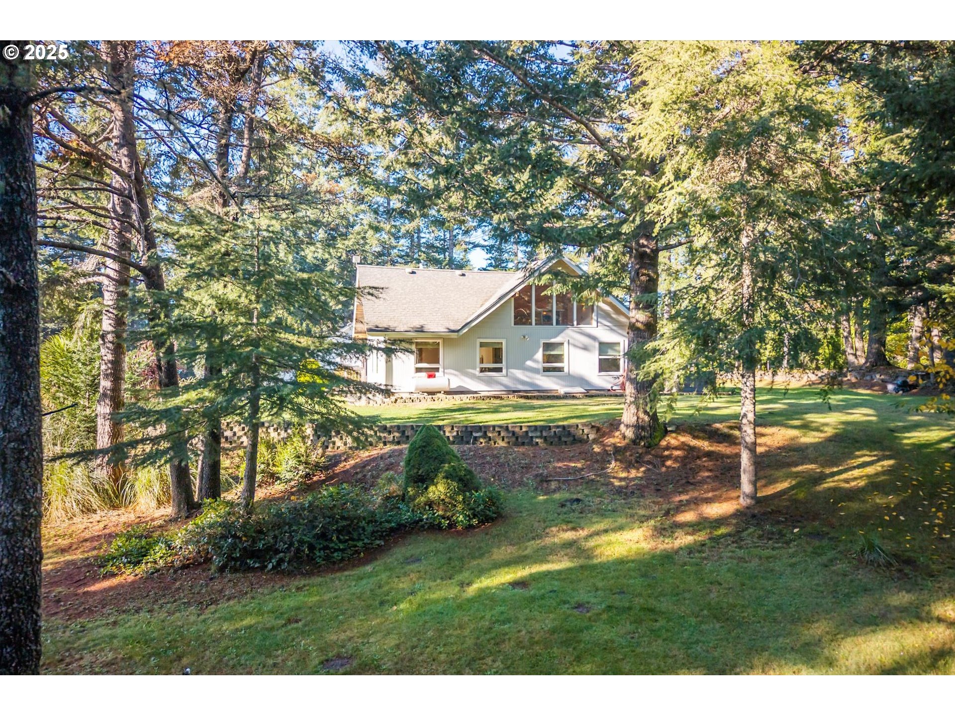 54177 Morrison Road Bandon, OR 97411 - Photo 43 of 47 a house view with a outdoor space