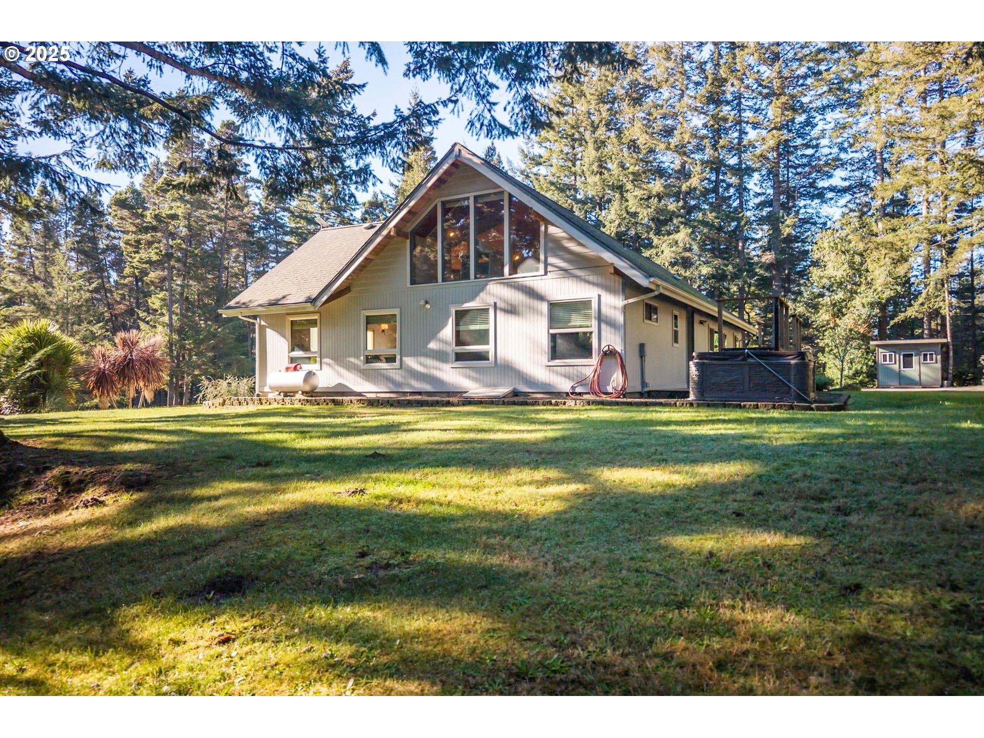 54177 Morrison Road Bandon, OR 97411 - Photo 45 of 47 a view of house that has a small yard
