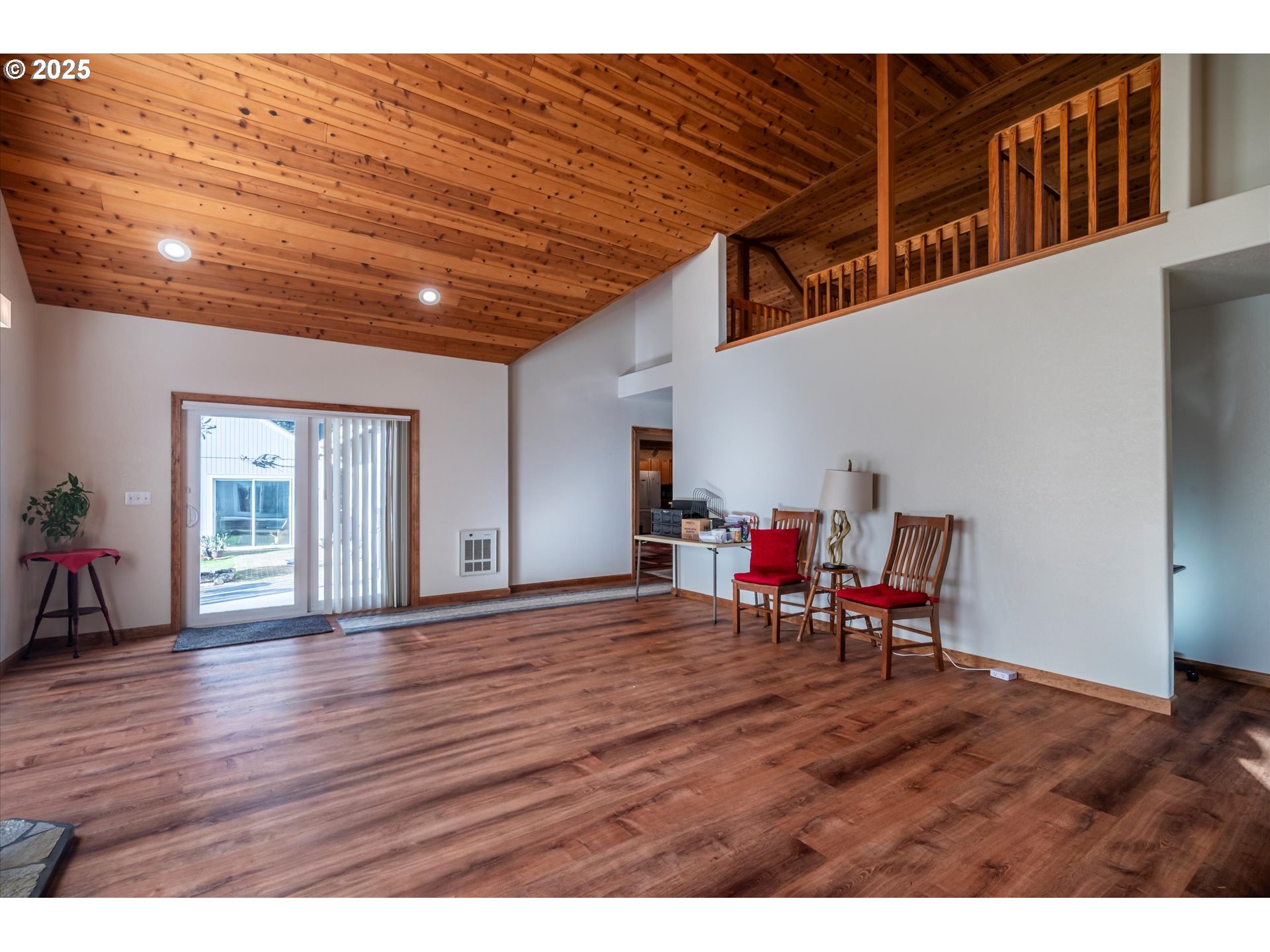 54177 Morrison Road Bandon, OR 97411 - Photo 7 of 47 a view of empty room with wooden floor and furniture