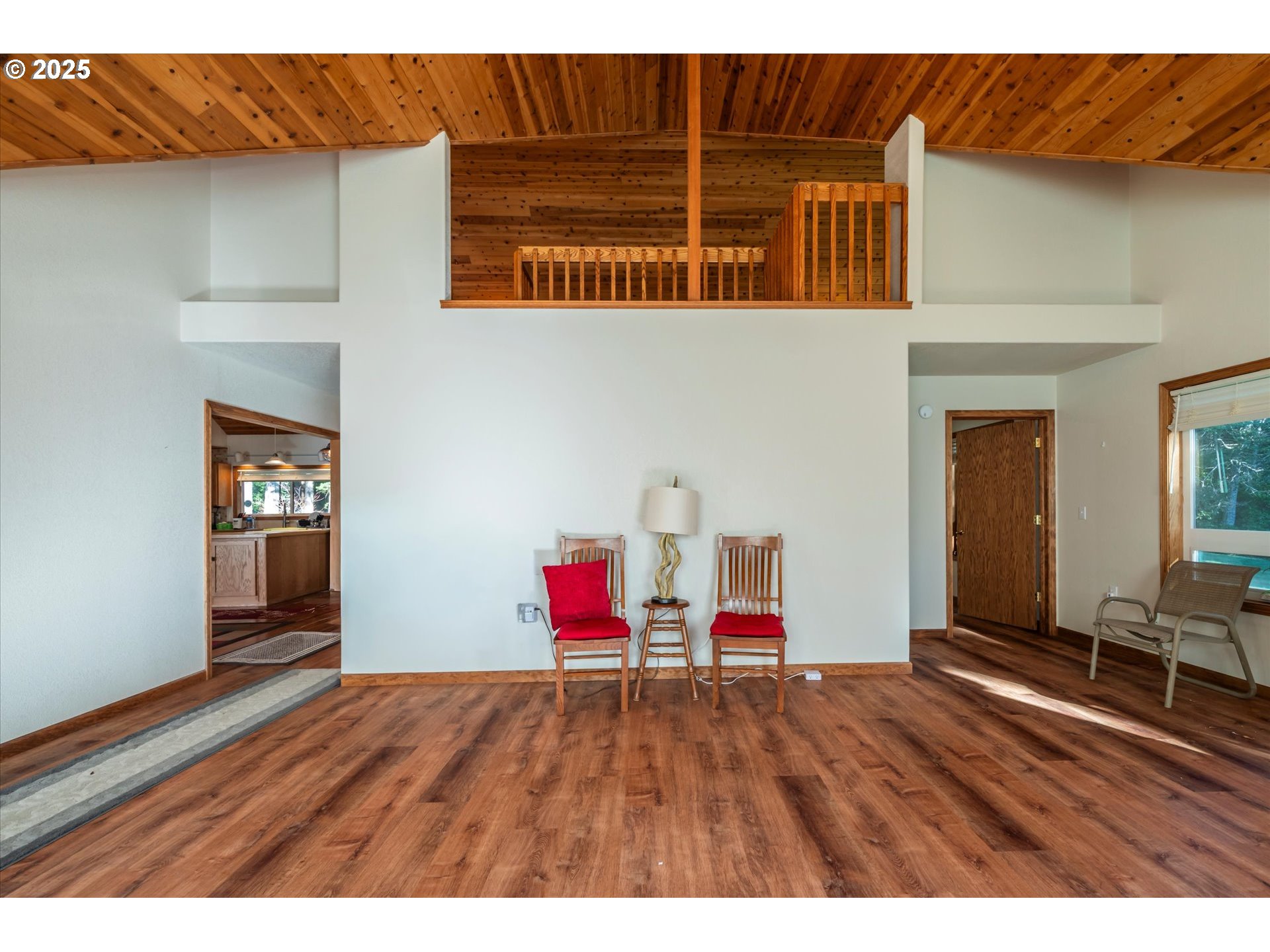 54177 Morrison Road Bandon, OR 97411 - Photo 9 of 47 a view of empty room with wooden floor