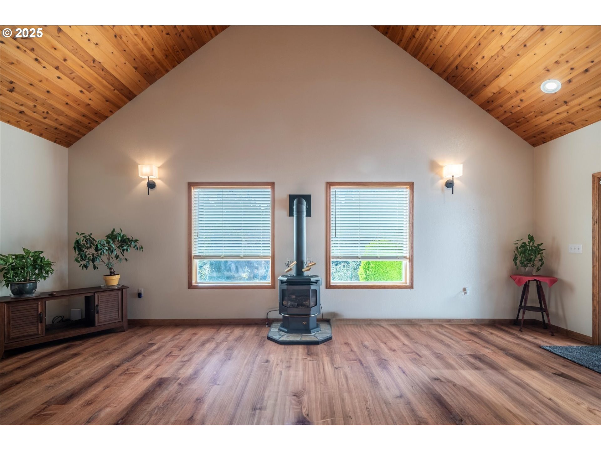 54177 Morrison Road Bandon, OR 97411 - Photo 10 of 47 a view of an empty room with wooden floor and a window