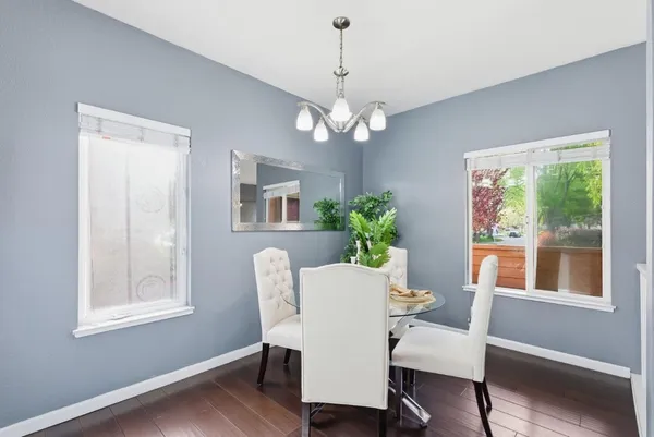 a view of a dining room with furniture window and wooden floor