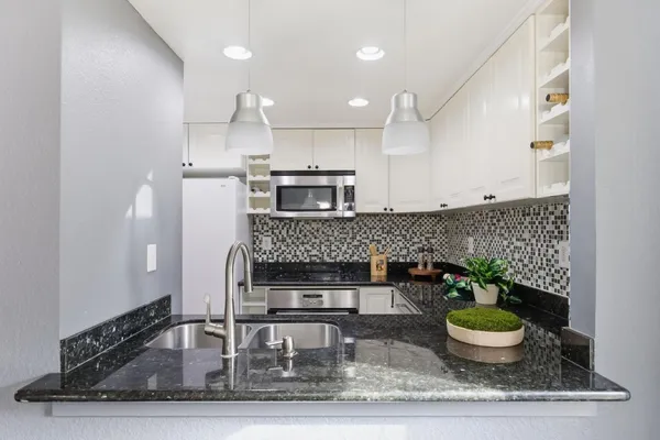 a kitchen with a table and chairs