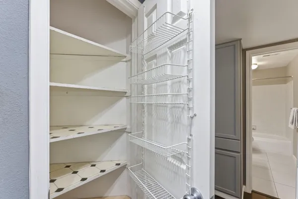 a bathroom with a window and a shower