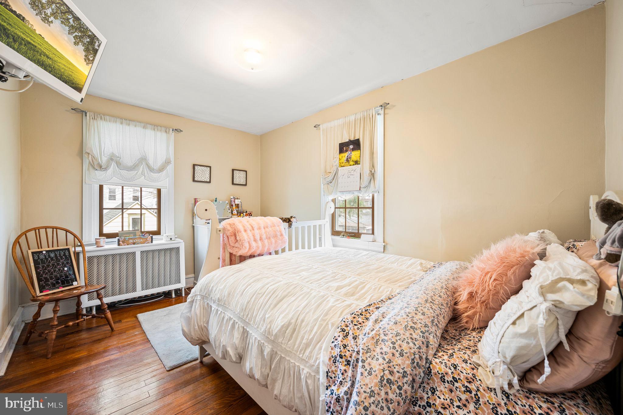 281 Wayne Avenue Lansdowne, PA 19050 - Photo 19 of 28 a bedroom with a bed and a window