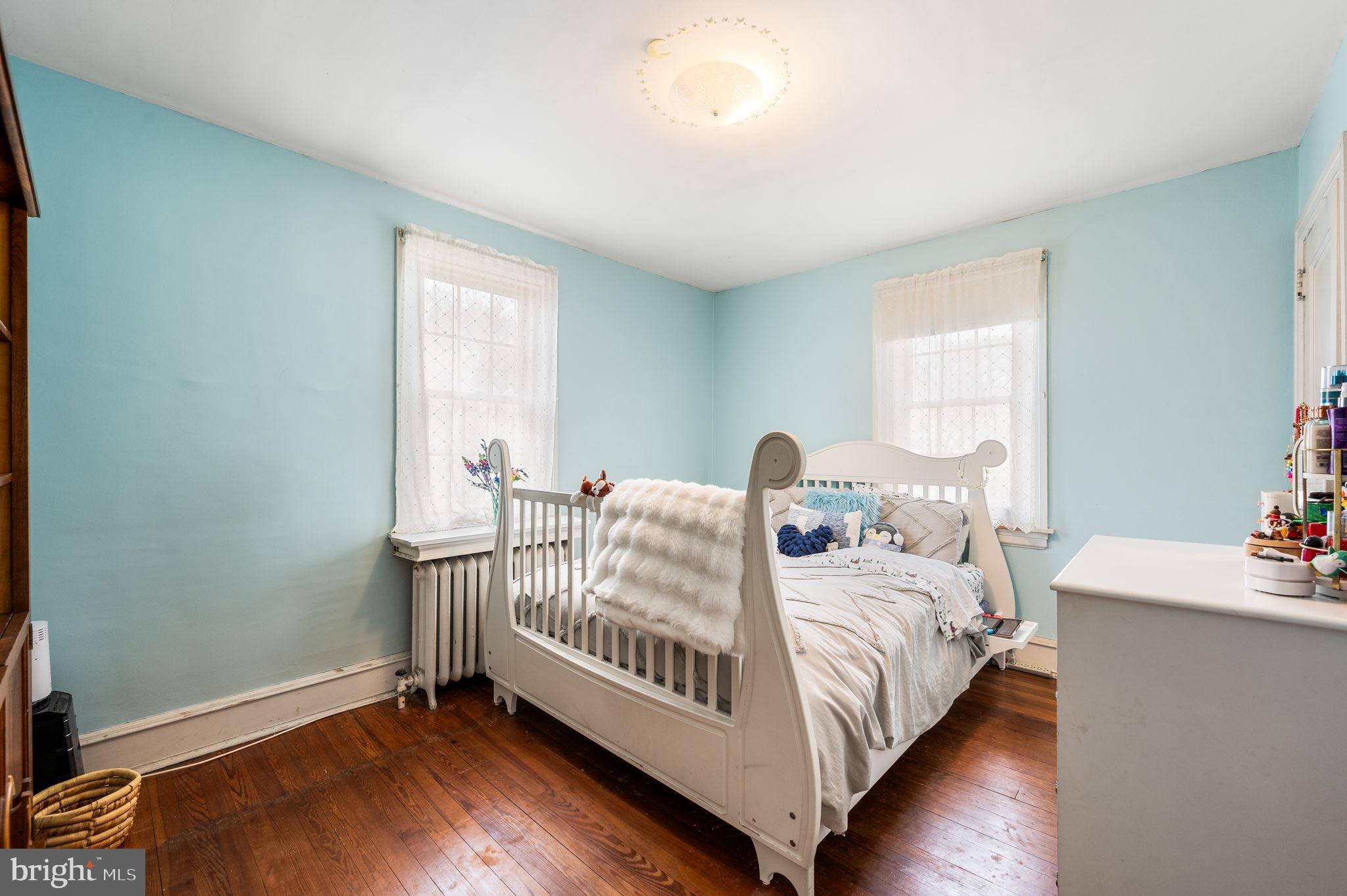 281 Wayne Avenue Lansdowne, PA 19050 - Photo 20 of 28 a bedroom with a bed and a table
