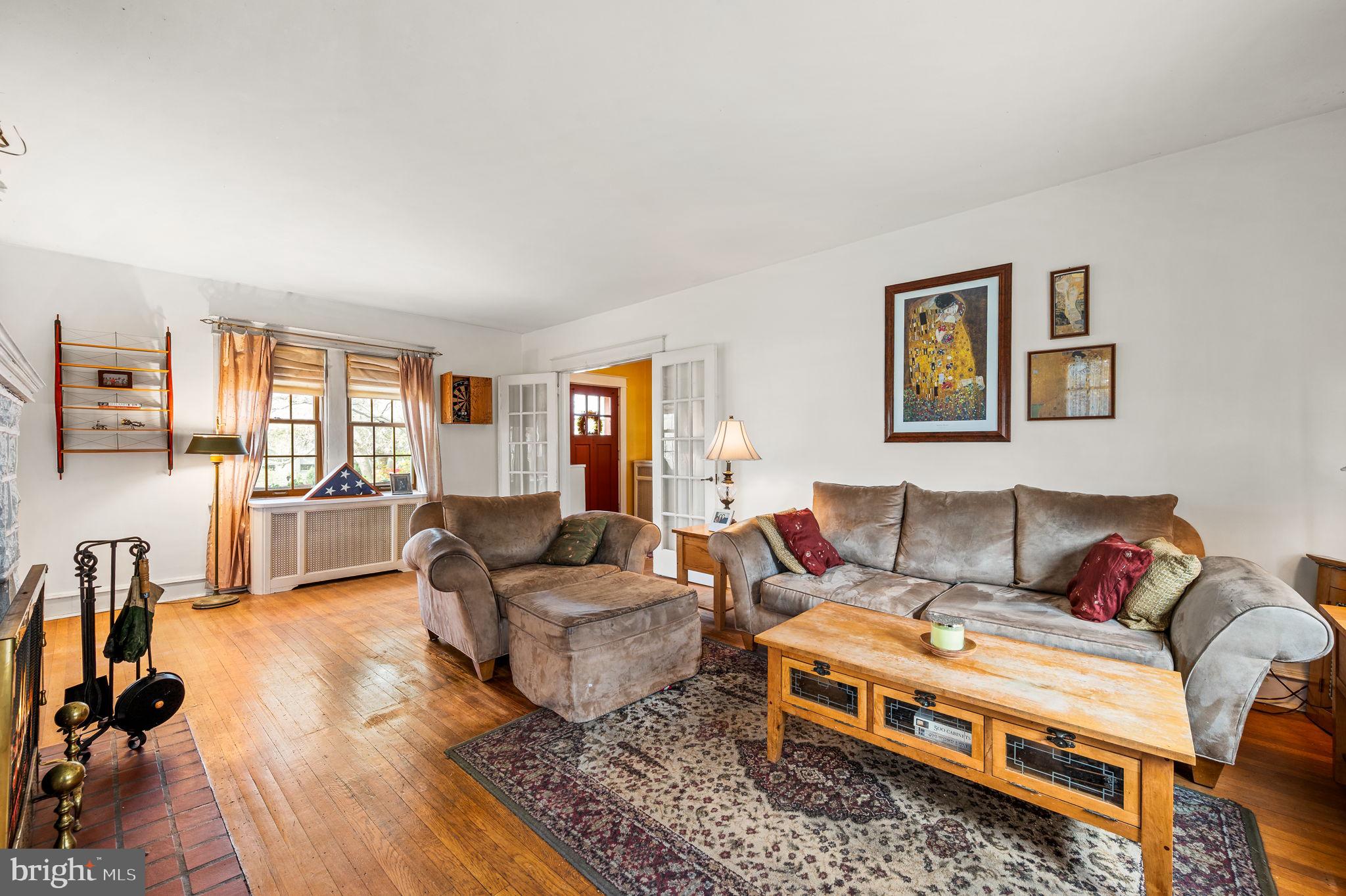 281 Wayne Avenue Lansdowne, PA 19050 - Photo 4 of 28 a living room with furniture and a wooden floor