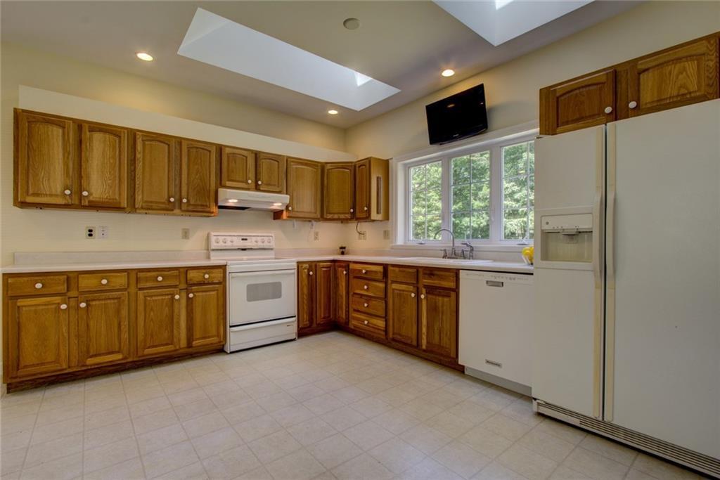 262 Boyle Road North Berwick, ME 03906 - Photo 12 of 28 Kitchen with 2 skylights, TV, and...