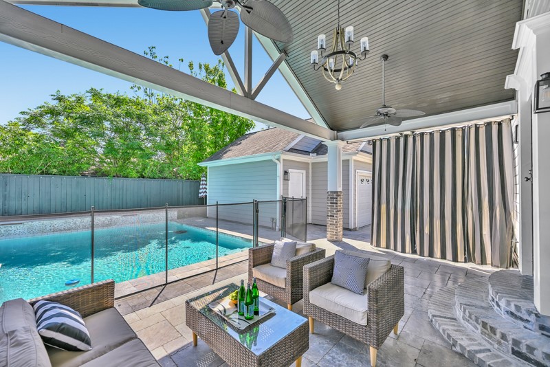 1122 East 23rd Street Houston, TX 77009 - Photo 17 of 23 Another view of the covered patio with seamless access to the pool and backyard.