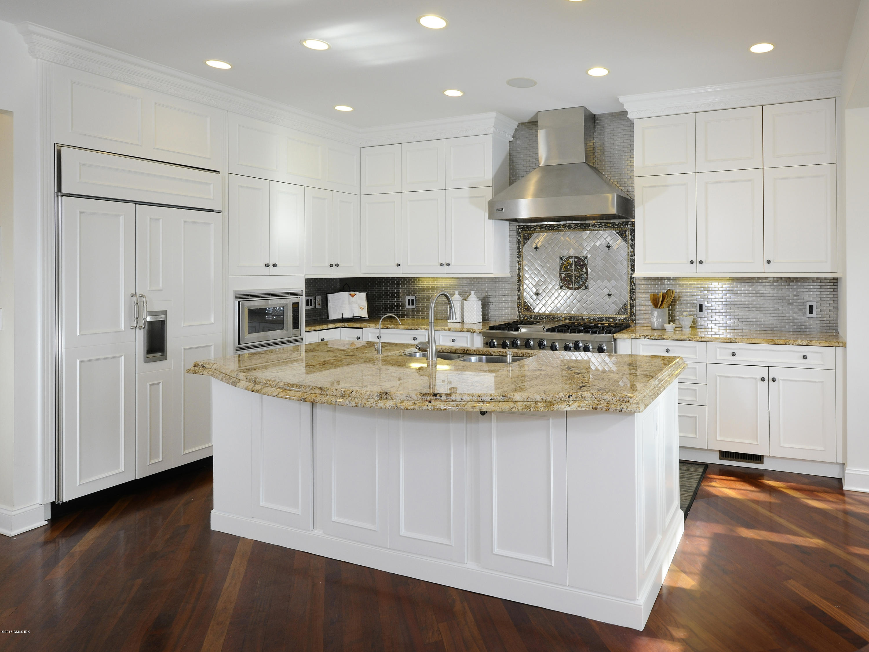34 Hendrie Avenue Riverside, CT 06878 - Photo 5 of 28 a kitchen with stainless steel appliances granite countertop a sink a stove and a refrigerator
