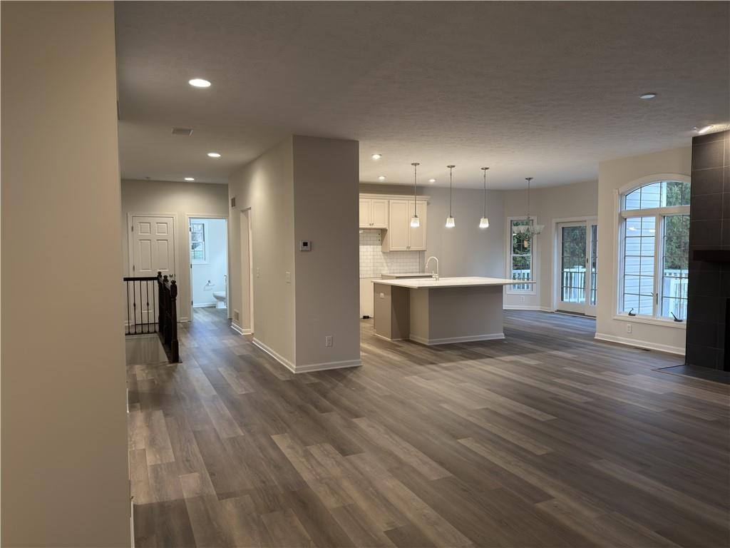 116 Brush Run Road Greensburg, PA 15601 - Photo 14 of 29 a view of a big room with wooden floor and a kitchen