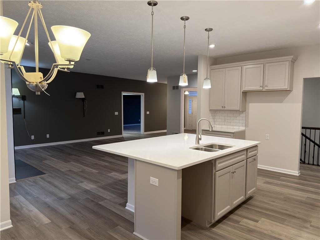 116 Brush Run Road Greensburg, PA 15601 - Photo 16 of 29 a kitchen with a sink a mirror and wooden floor