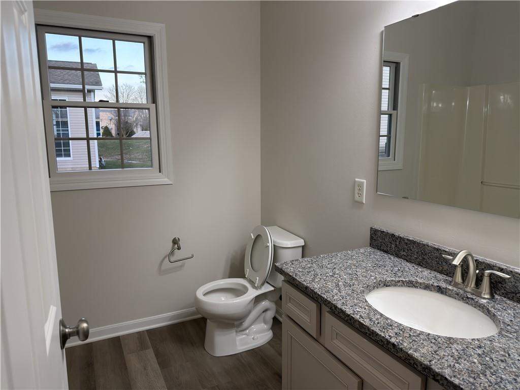 116 Brush Run Road Greensburg, PA 15601 - Photo 18 of 29 a bathroom with a granite countertop toilet a sink and a mirror