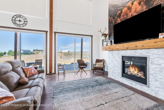 a bedroom with a large bed and a large window