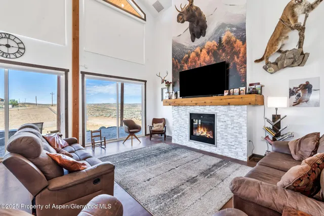 a spacious bedroom with a bed and a dresser