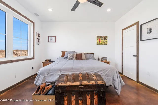 a view of a livingroom with furniture and a flat screen tv