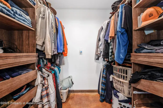 a view of a workspace with wooden floor and a bathroom