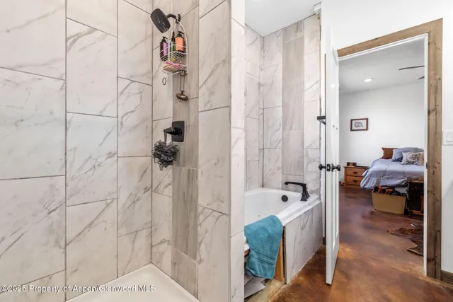 a bedroom with a bed and cabinets