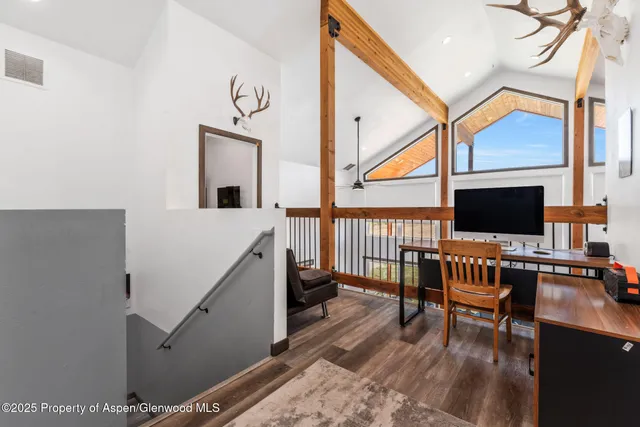 a view of a kitchen with furniture and a window