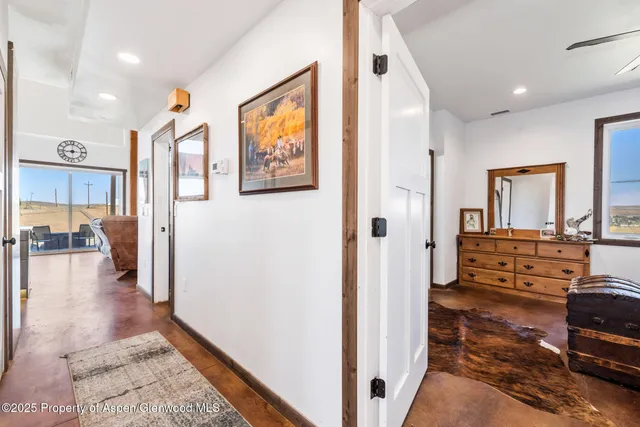 a bathroom with a granite countertop sink a toilet and a mirror