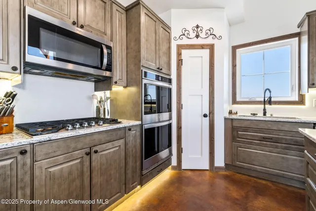 a living room with lots of furniture and a flat screen tv